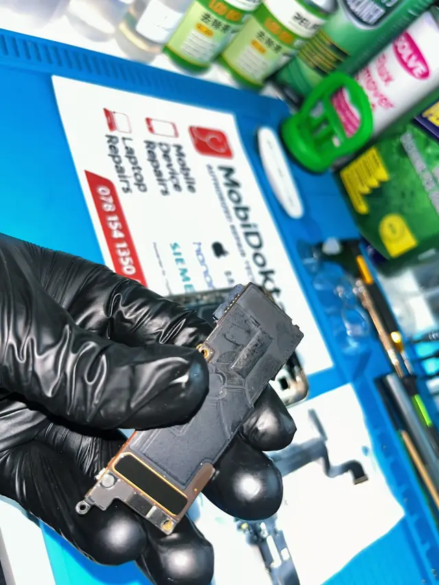 Water-damaged iPhone logic board after ultrasonic cleaning and corrosion removal
